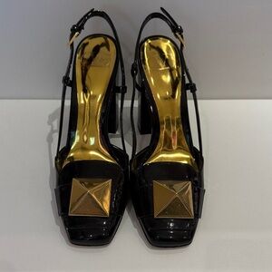 Valentino Garavani Black Patent Leather Slingback Heels with Gold Accents